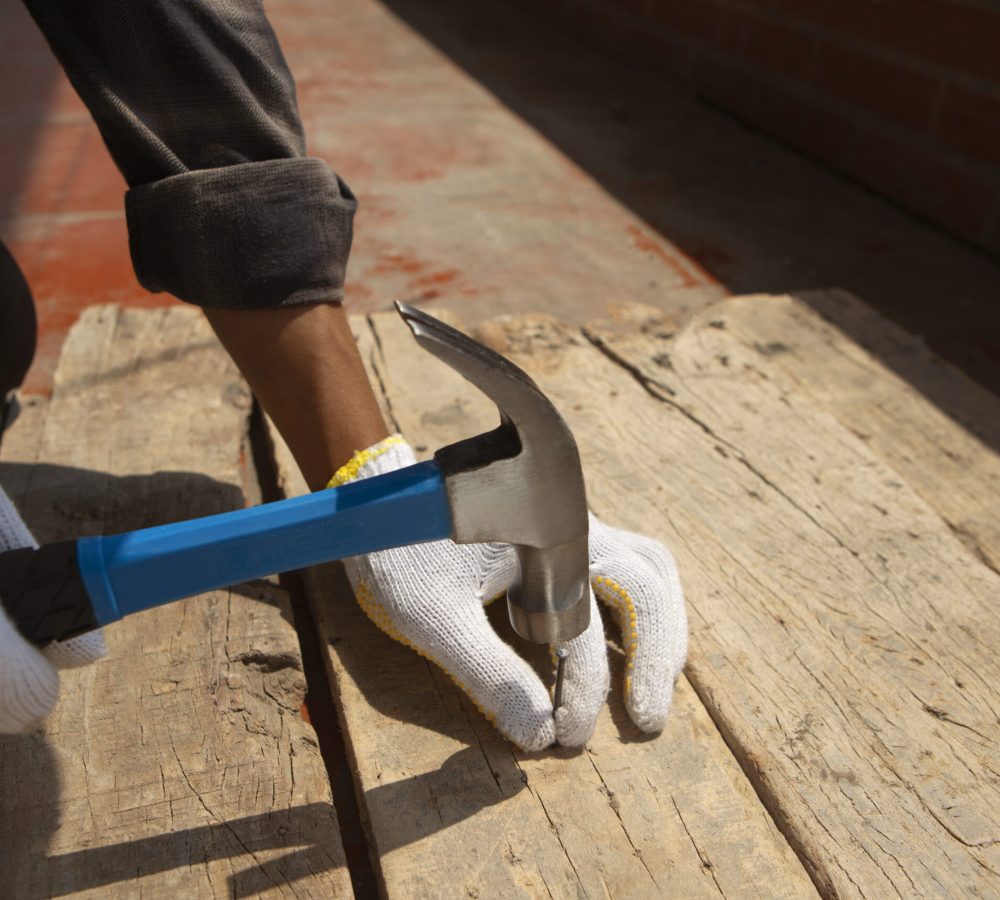 construction-worker-using-hammer-job-site