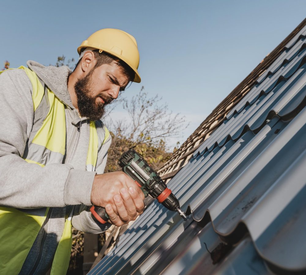 sideways-man-working-roof-with-drill